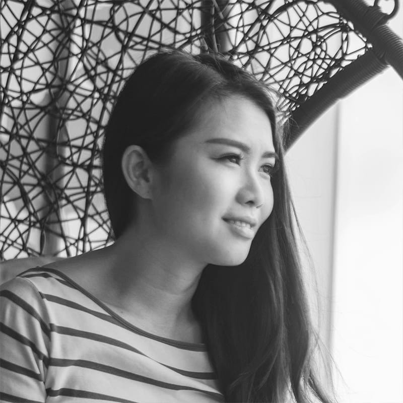 mimi-thian-c_HgTBTyJQs-unsplash copy A woman smiling